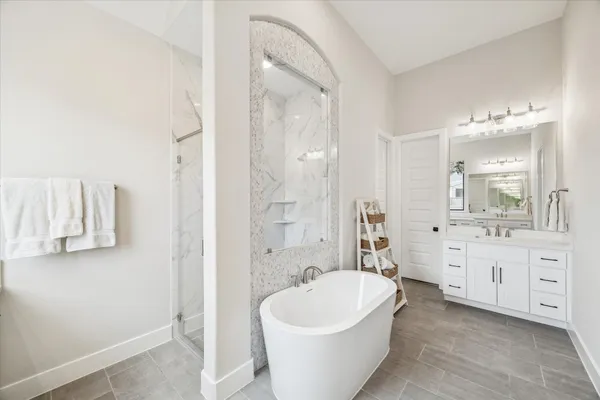 a bathroom with a sink vanity and a mirror