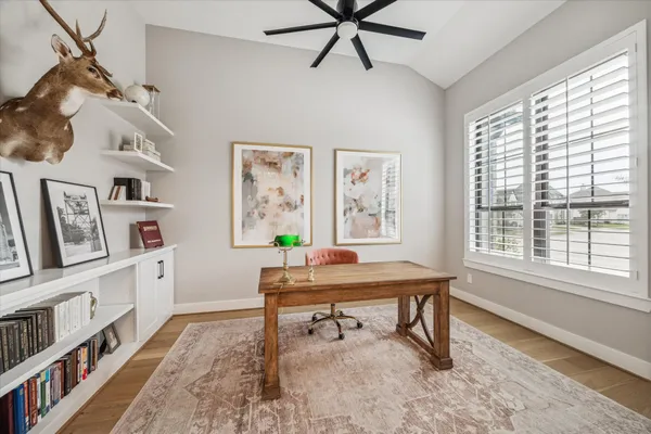 a workspace with furniture and window