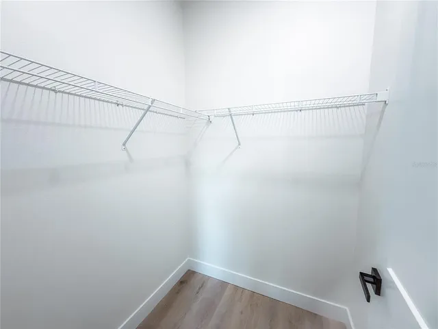 a view of a room with racks on the wall