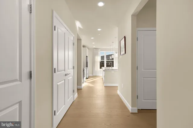 a view of a hallway with a white walls