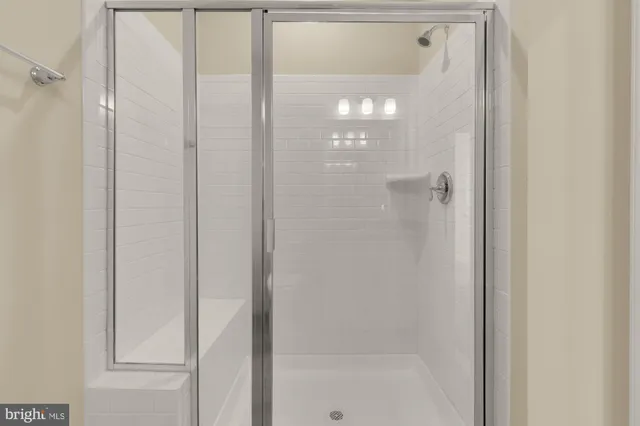 a bathroom with a glass shower door