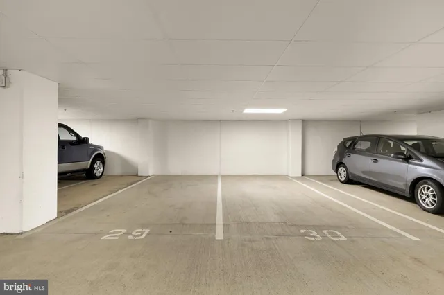 a view of parking area and car parked