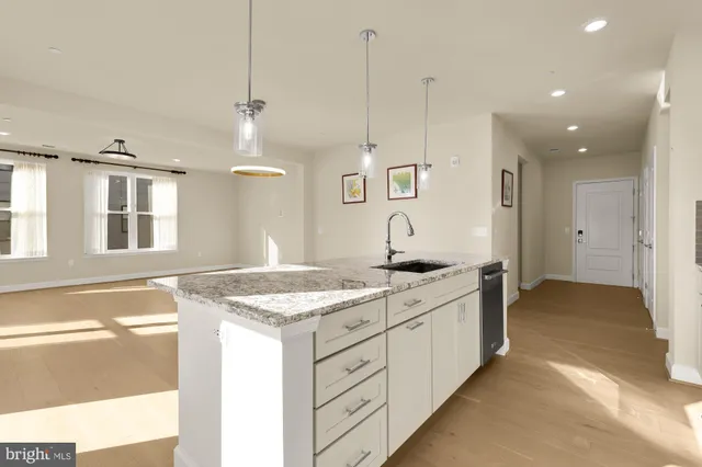 a kitchen with a sink stove and refrigerator