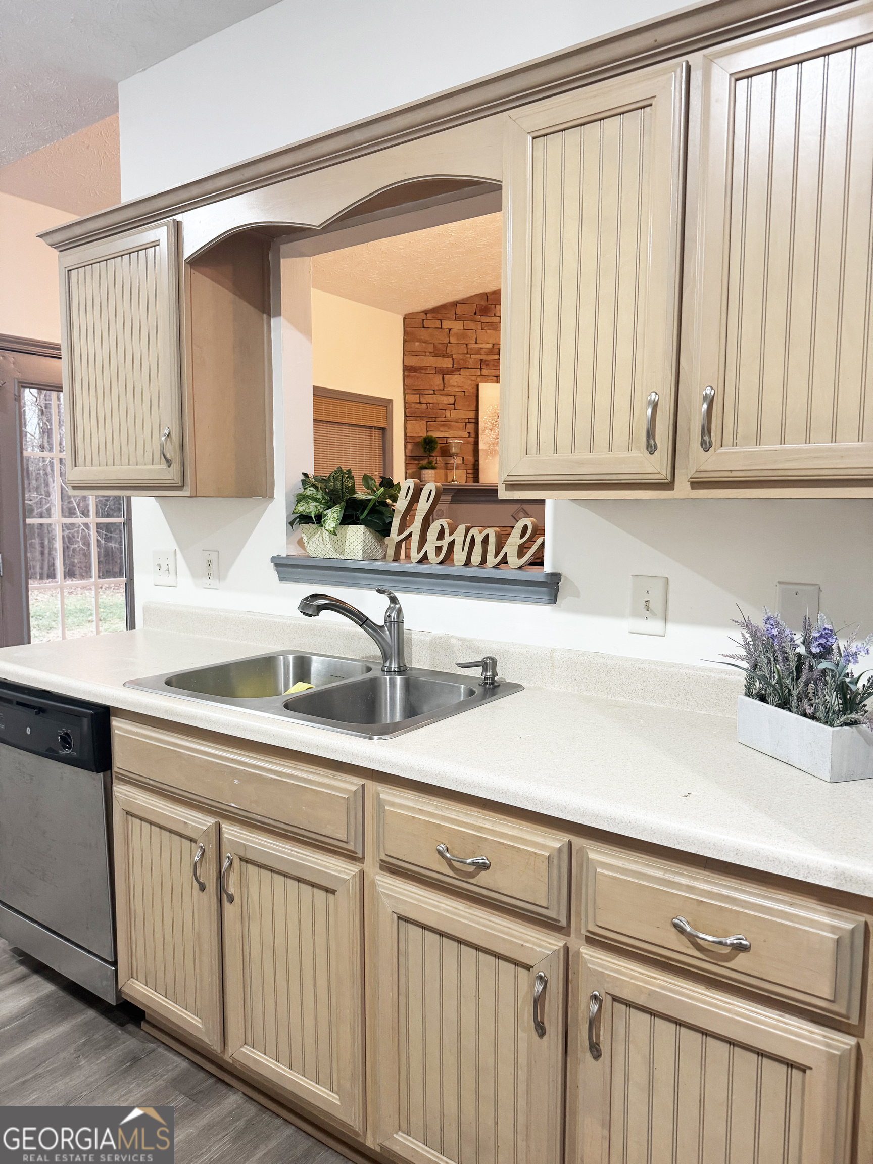 314 Hickory Road Jackson, GA 30233 - Photo 12 of 23 a kitchen with white cabinets and a sink