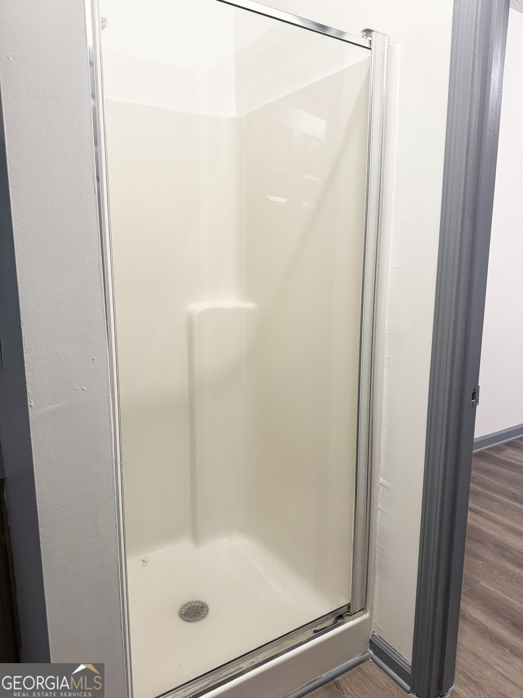 314 Hickory Road Jackson, GA 30233 - Photo 14 of 23 a bathroom with a glass shower door