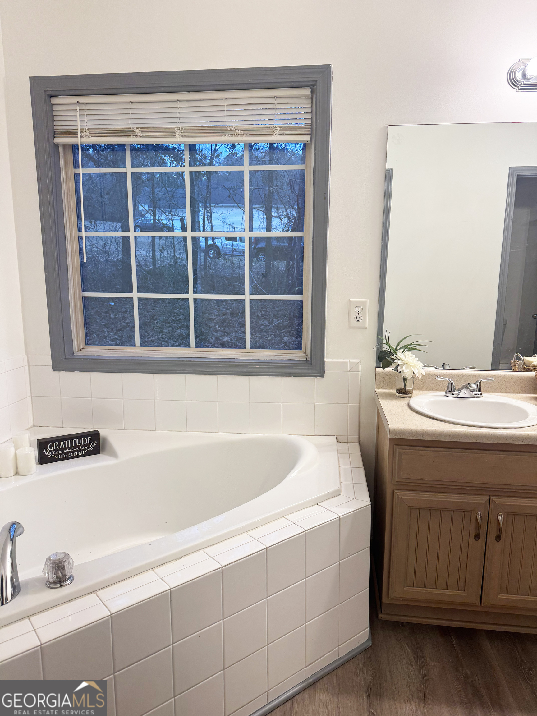 314 Hickory Road Jackson, GA 30233 - Photo 18 of 23 a bathroom with a tub sink and mirror