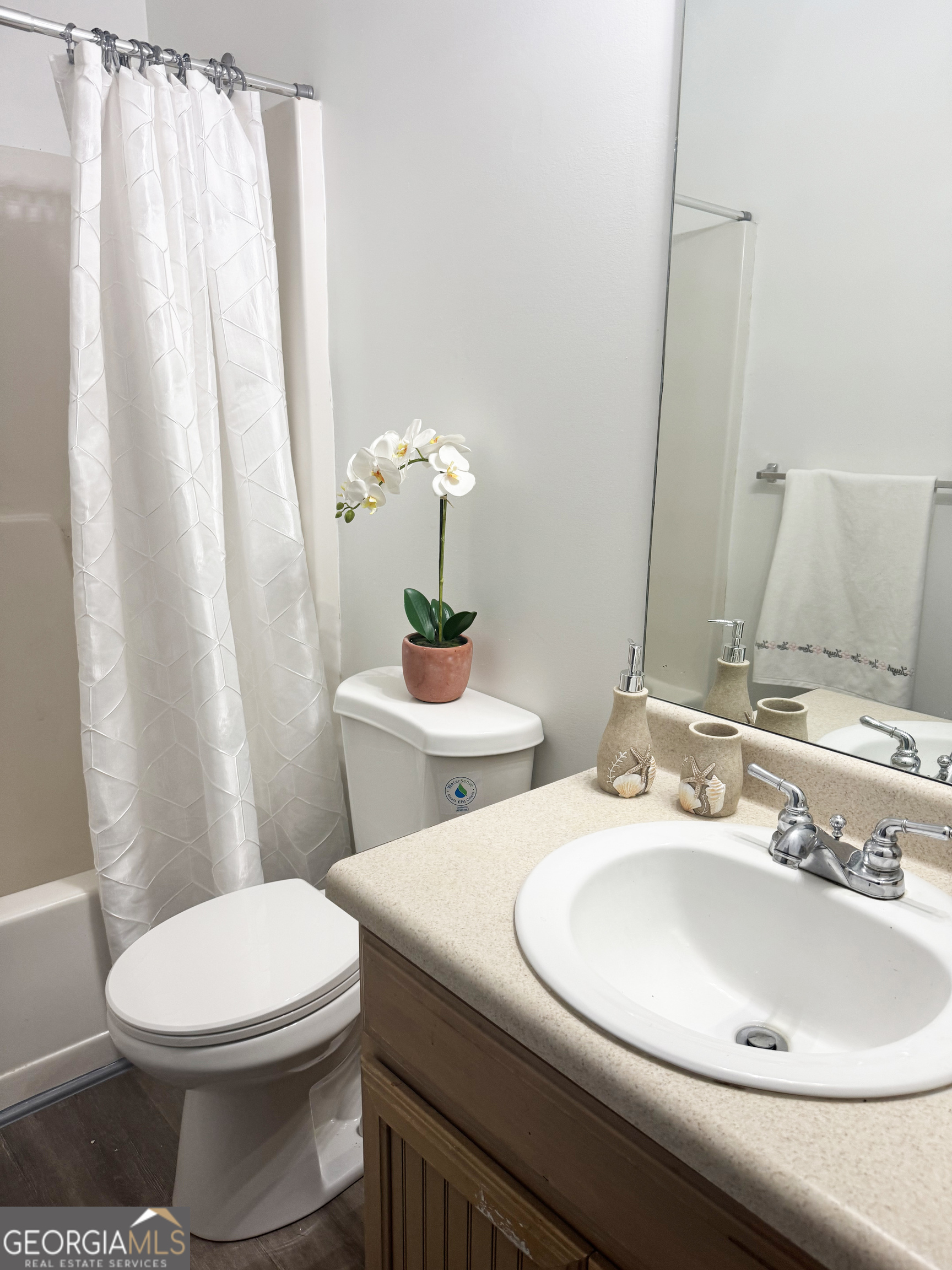 314 Hickory Road Jackson, GA 30233 - Photo 20 of 23 a bathroom with a toilet sink and mirror