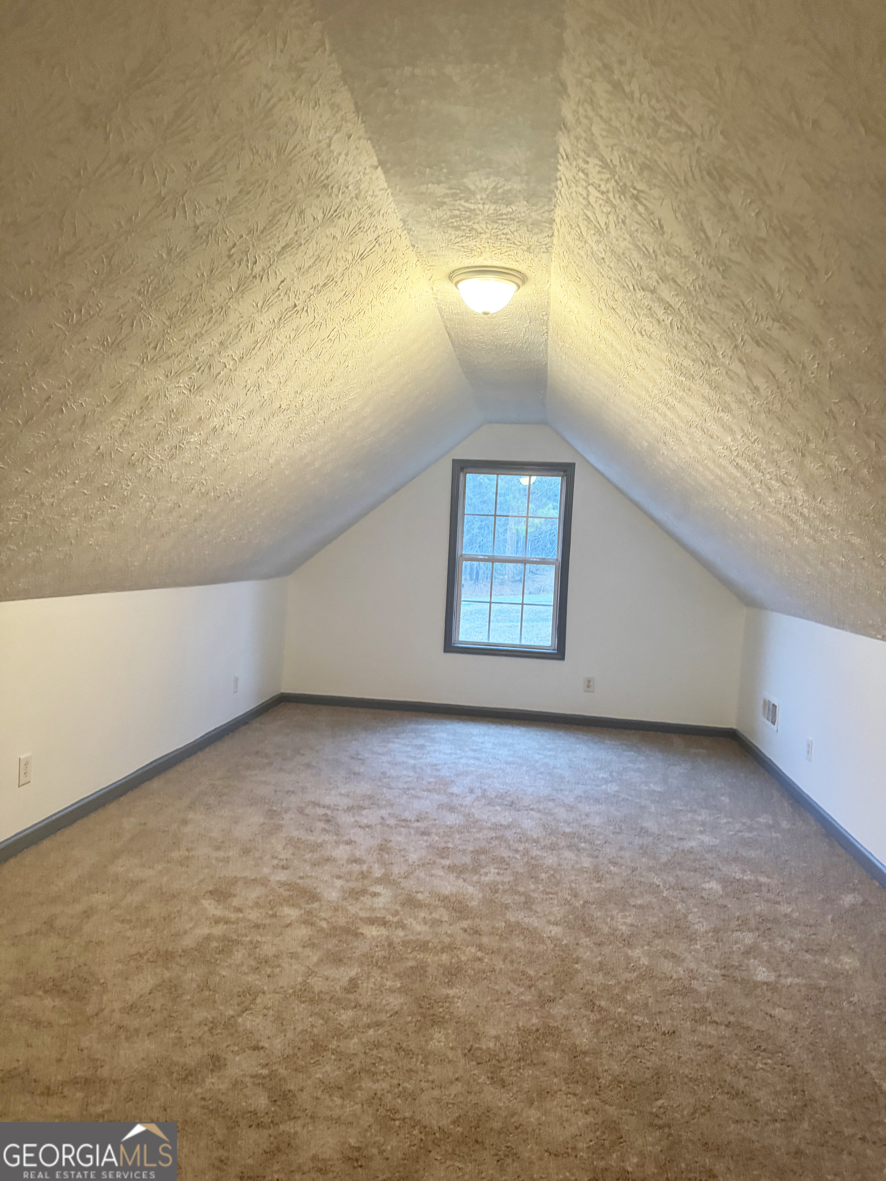 314 Hickory Road Jackson, GA 30233 - Photo 21 of 23 a view of an empty room with a window