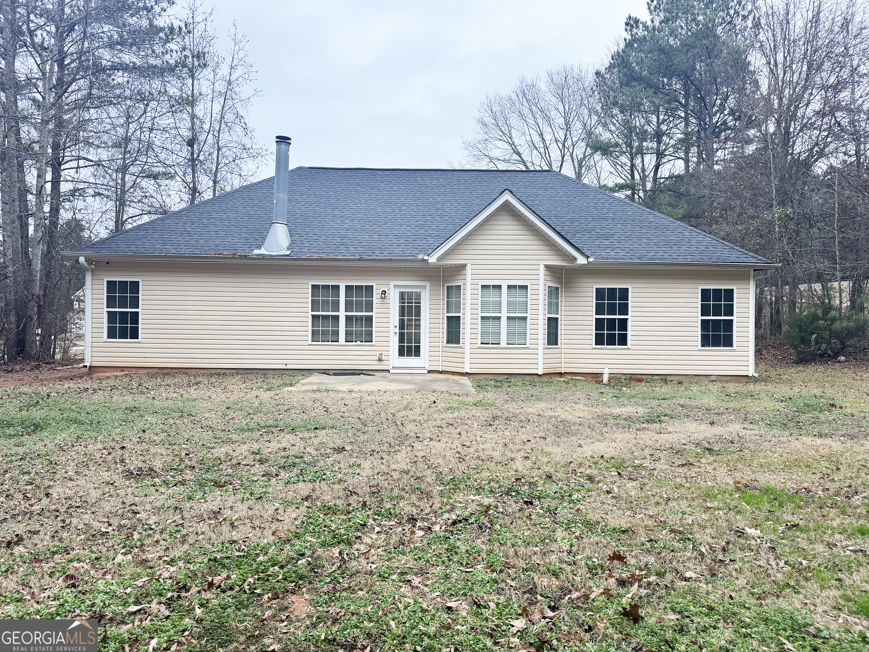 314 Hickory Road Jackson, GA 30233 - Photo 22 of 23 a house with green field in front of it
