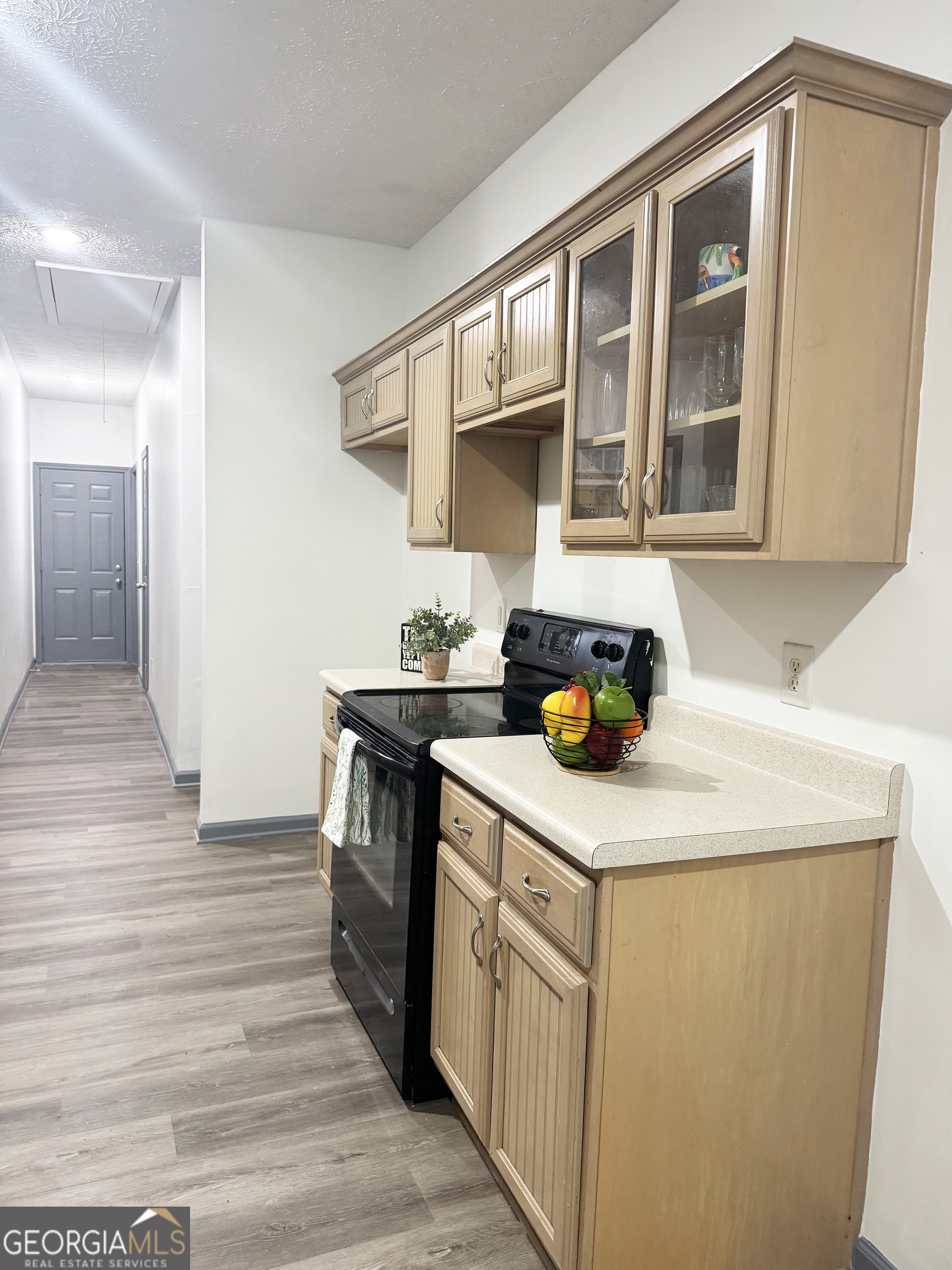 314 Hickory Road Jackson, GA 30233 - Photo 10 of 23 a kitchen with a stove and a cabinets