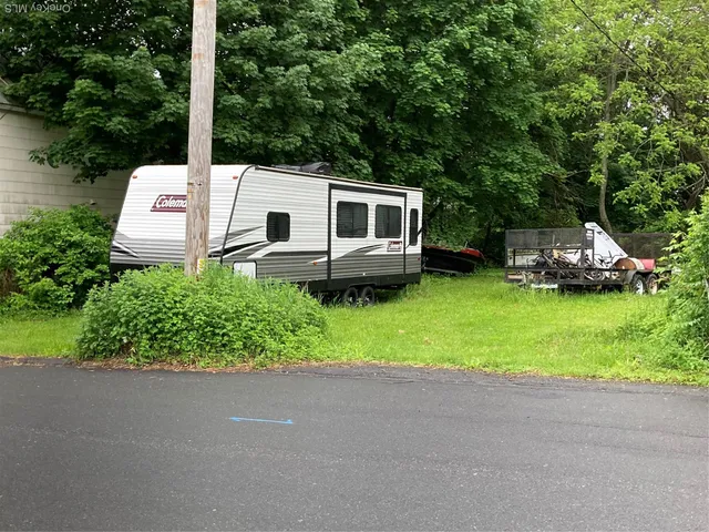 a backyard of a house with lots of green space