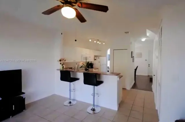 a view of dining room with furniture and chandelier