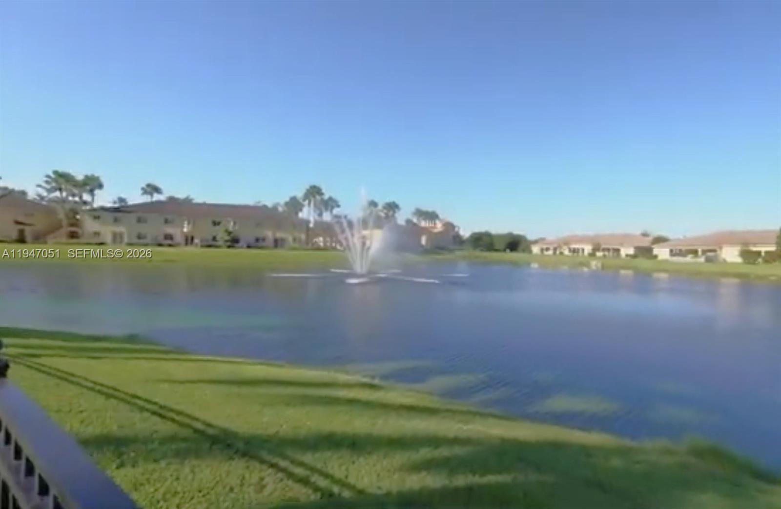 1485 Northeast 33rd Road, Unit 1011 Homestead, FL 33033 - Photo 5 of 7 a view of a lake with houses in the back