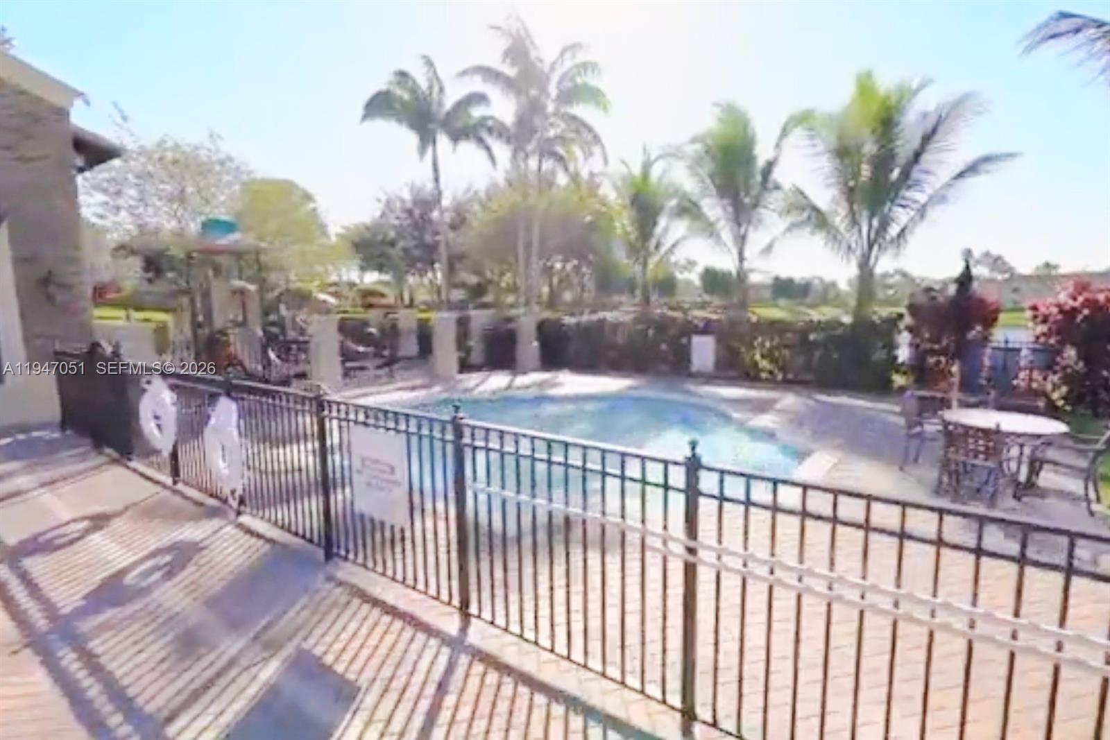 1485 Northeast 33rd Road, Unit 1011 Homestead, FL 33033 - Photo 6 of 7 a view of a swimming pool with a terrace