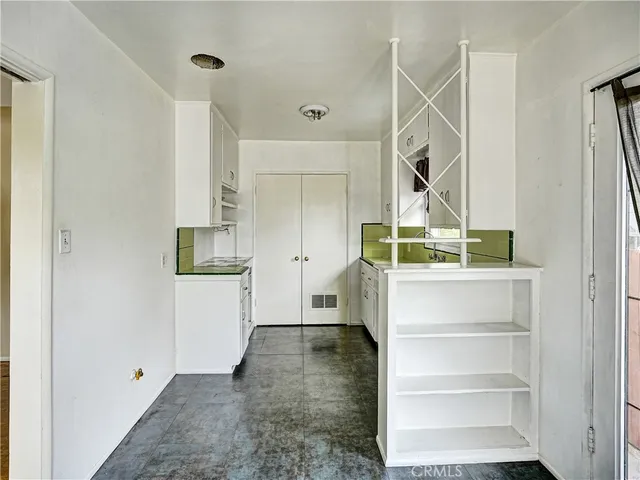 a view of hallway with stairs and wooden floor