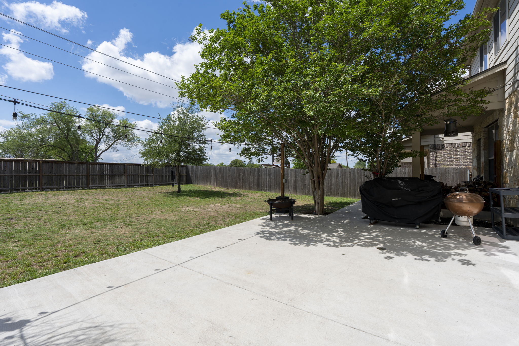 227 Sandstone Trail Buda, TX 78610 - Photo 28 of 33 Expansive concrete patio offering a large outdoor living area