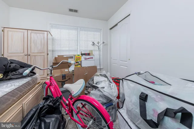 a view of storage and utility room with racks on the walls