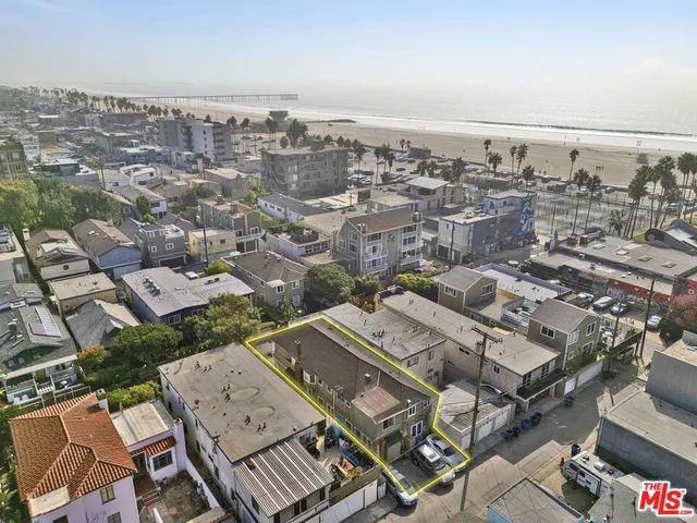 an aerial view of a city with parking space