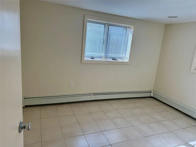 an empty room with a bench