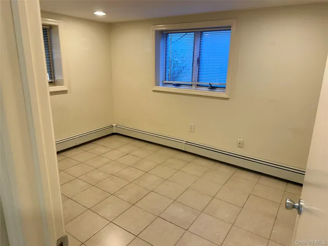 an empty room with a bench