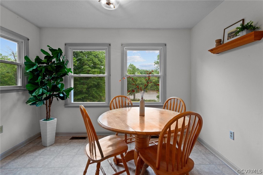 1692 Miller Lk Road Rice, VA 23966 - Photo 11 of 35 a dining room with furniture and window