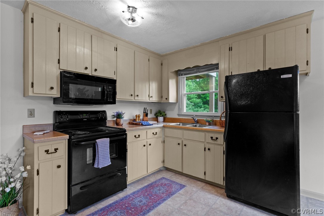 1692 Miller Lk Road Rice, VA 23966 - Photo 12 of 35 a kitchen with a refrigerator stove and microwave