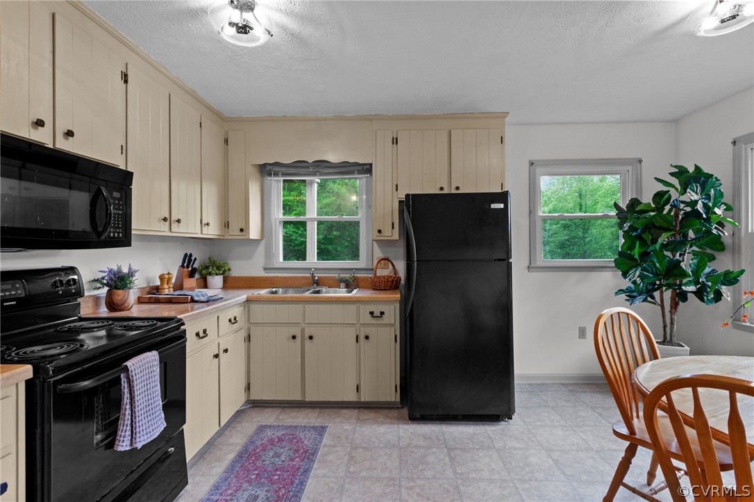 1692 Miller Lk Road Rice, VA 23966 - Photo 13 of 35 a kitchen with a refrigerator and a stove top oven