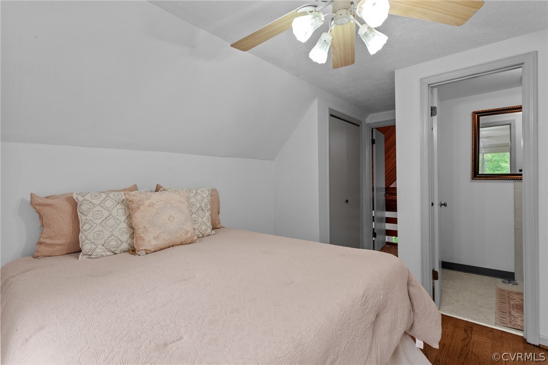 1692 Miller Lk Road Rice, VA 23966 - Photo 23 of 35 a bedroom with a large bed and a chandelier