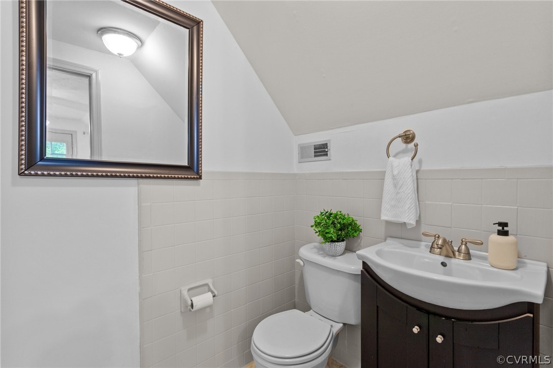 1692 Miller Lk Road Rice, VA 23966 - Photo 26 of 35 a bathroom with a sink vanity mirror and toilet