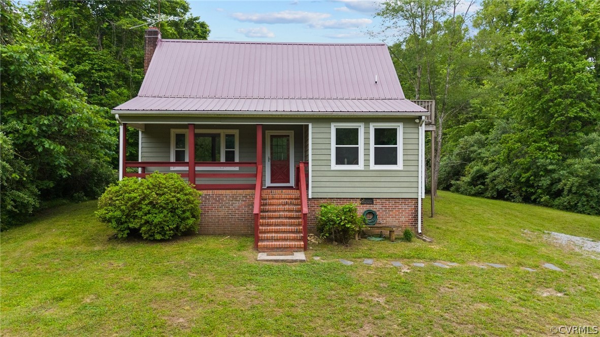 1692 Miller Lk Road Rice, VA 23966 - Photo 3 of 35 a front view of a house with garden