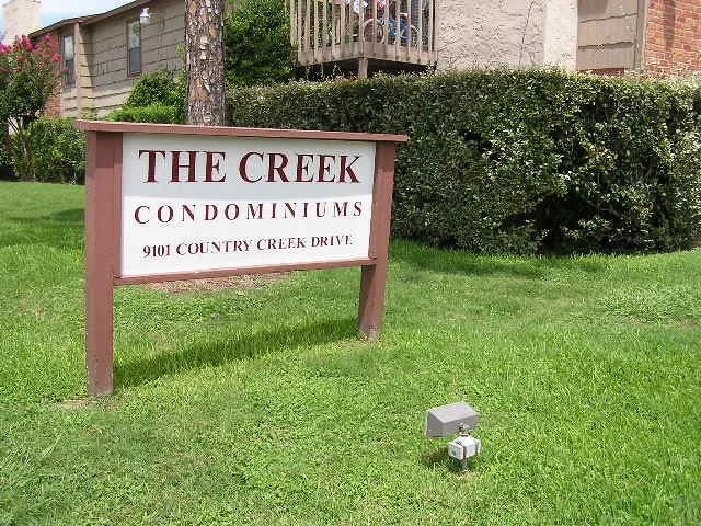 a sign on the side of the road