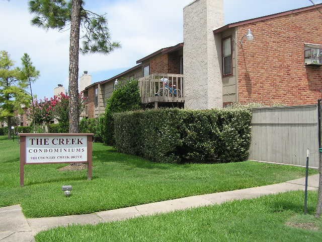 9101 Country Creek Street, Unit 403 Houston, TX 77074 - Photo 5 of 11 a sign on the side of the building