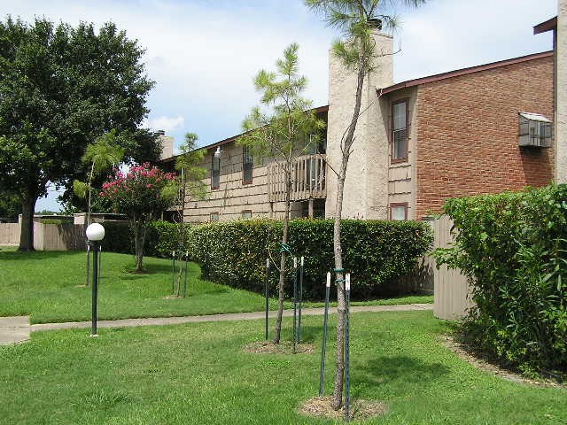 9101 Country Creek Street, Unit 403 Houston, TX 77074 - Photo 8 of 11 a view of a house with a yard