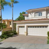 a house that has a tree in front of it
