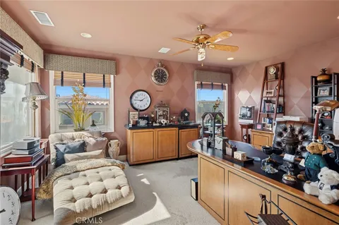 a living room with lots of furniture and window