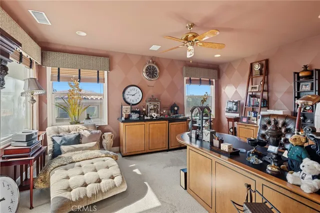 a living room with lots of furniture and window