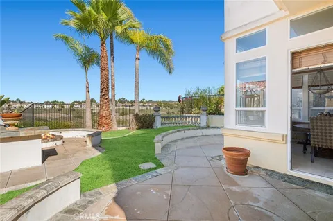 a view of a patio with couches and potted plants