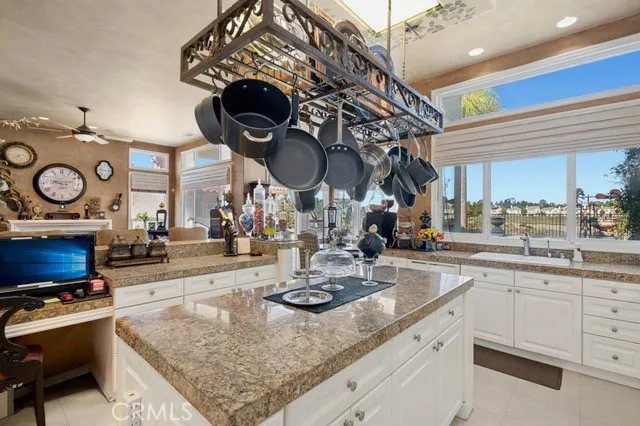 a kitchen with a sink a stove and cabinets