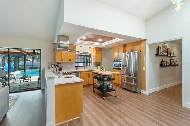 a kitchen with stainless steel appliances granite countertop a stove and a refrigerator