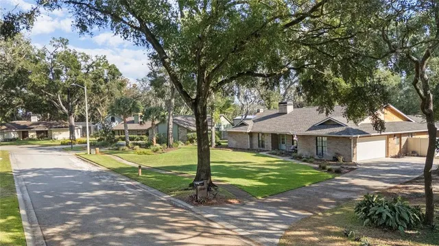 an aerial view of residential building and lake