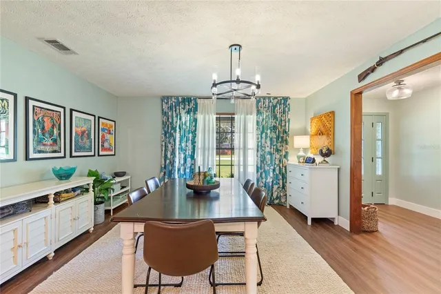 a view of a kitchen cabinets and wooden floor