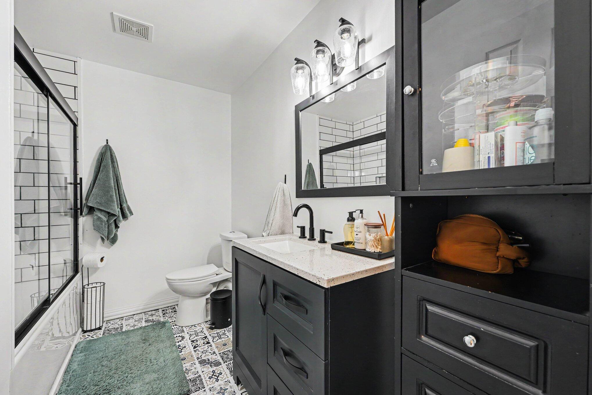 835 North Indiana Street Griffith, IN 46319 - Photo 15 of 19 a bathroom with a toilet sink and mirror