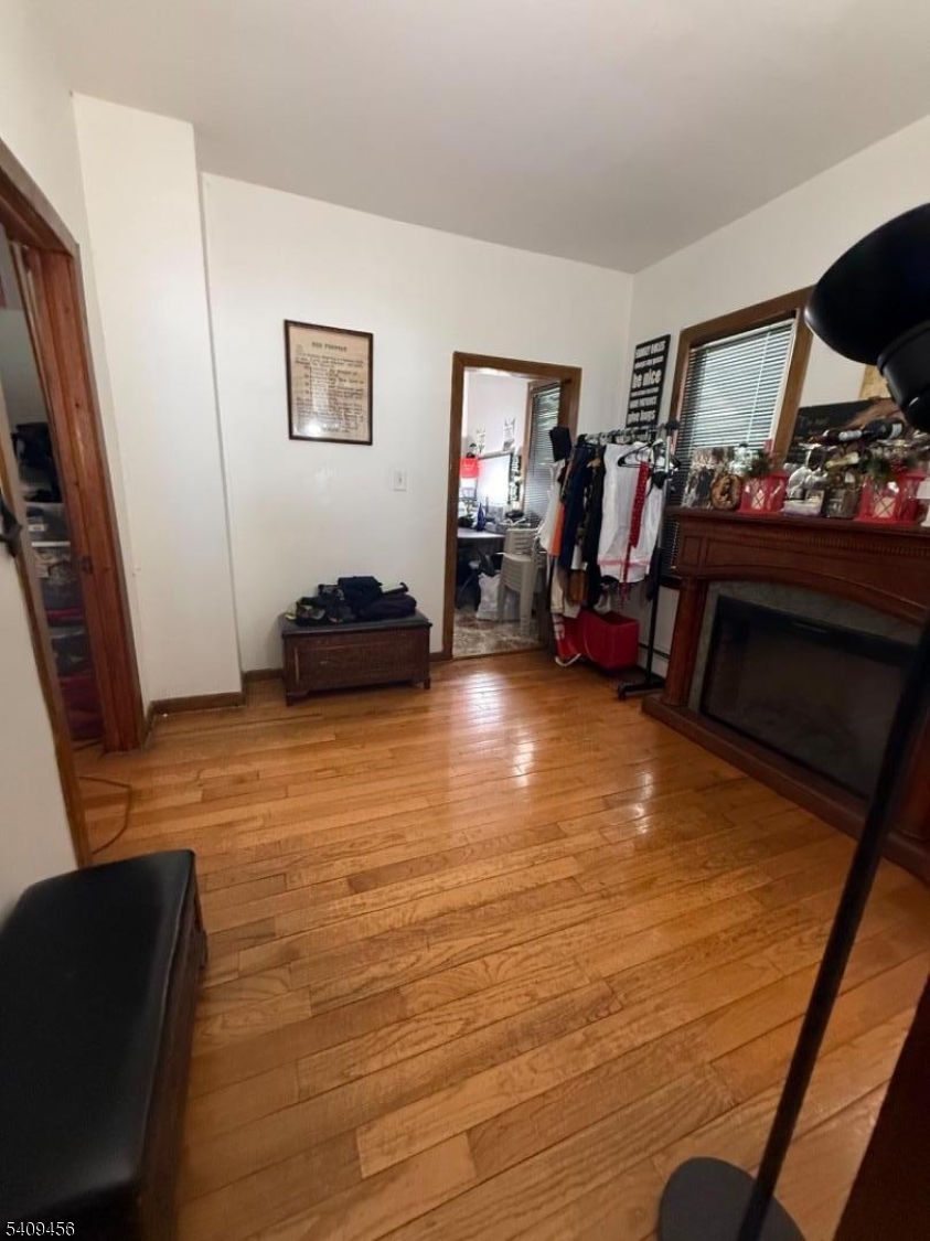 744 Trumbull Street Elizabeth, NJ 07201 - Photo 13 of 13 a living room with furniture and a flat screen tv