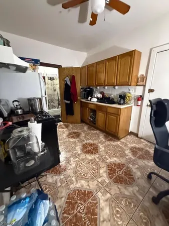 a kitchen with a sink and a stove top oven