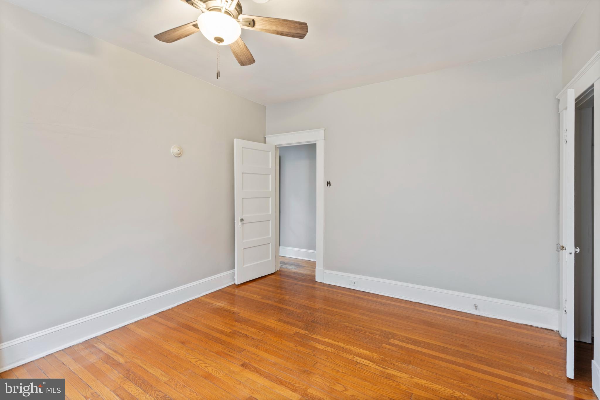 639 Plymouth Road Baltimore, MD 21229 - Photo 11 of 16 a view of empty room with wooden floor