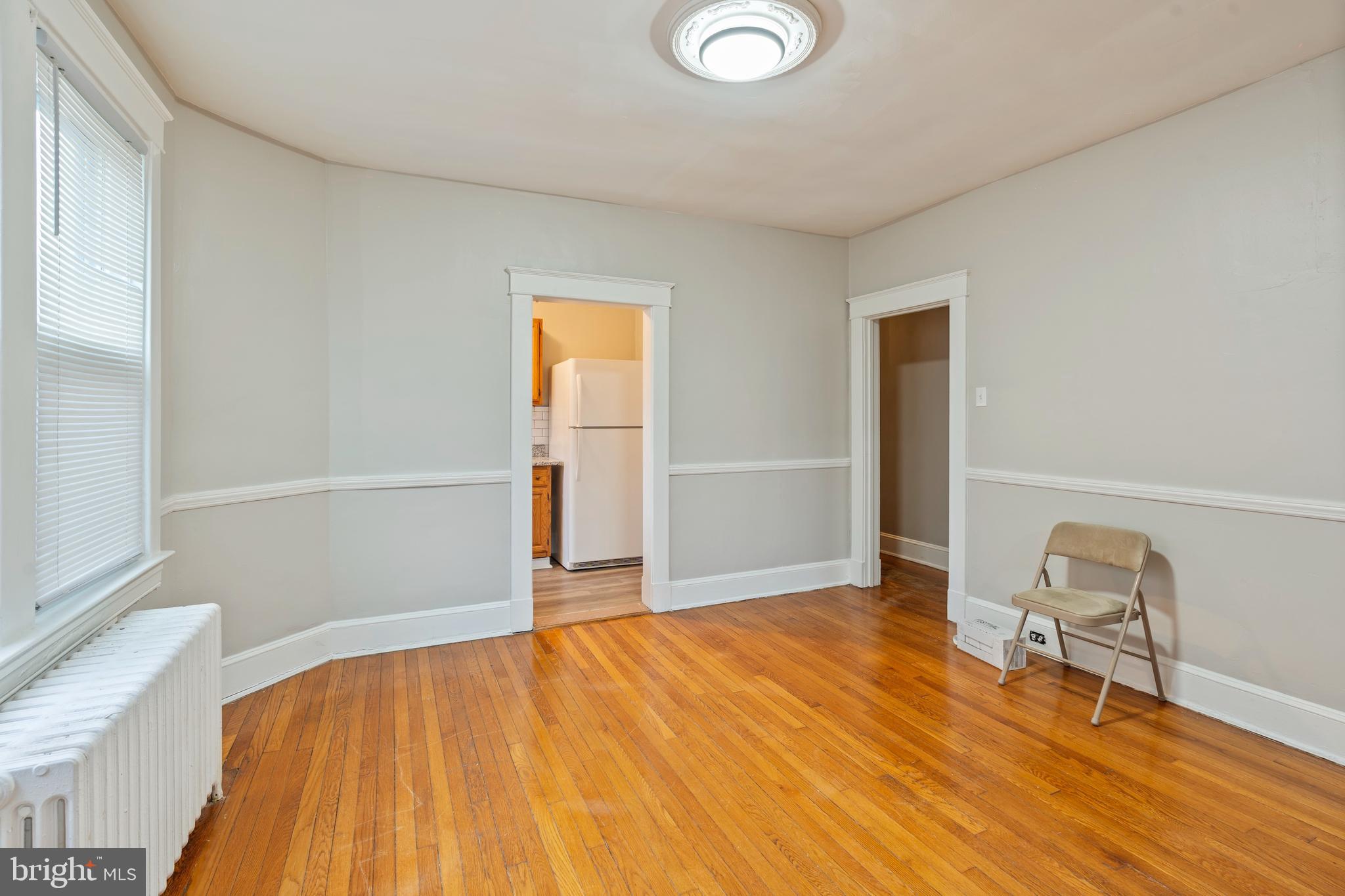 639 Plymouth Road Baltimore, MD 21229 - Photo 5 of 16 a view of empty room with wooden floor