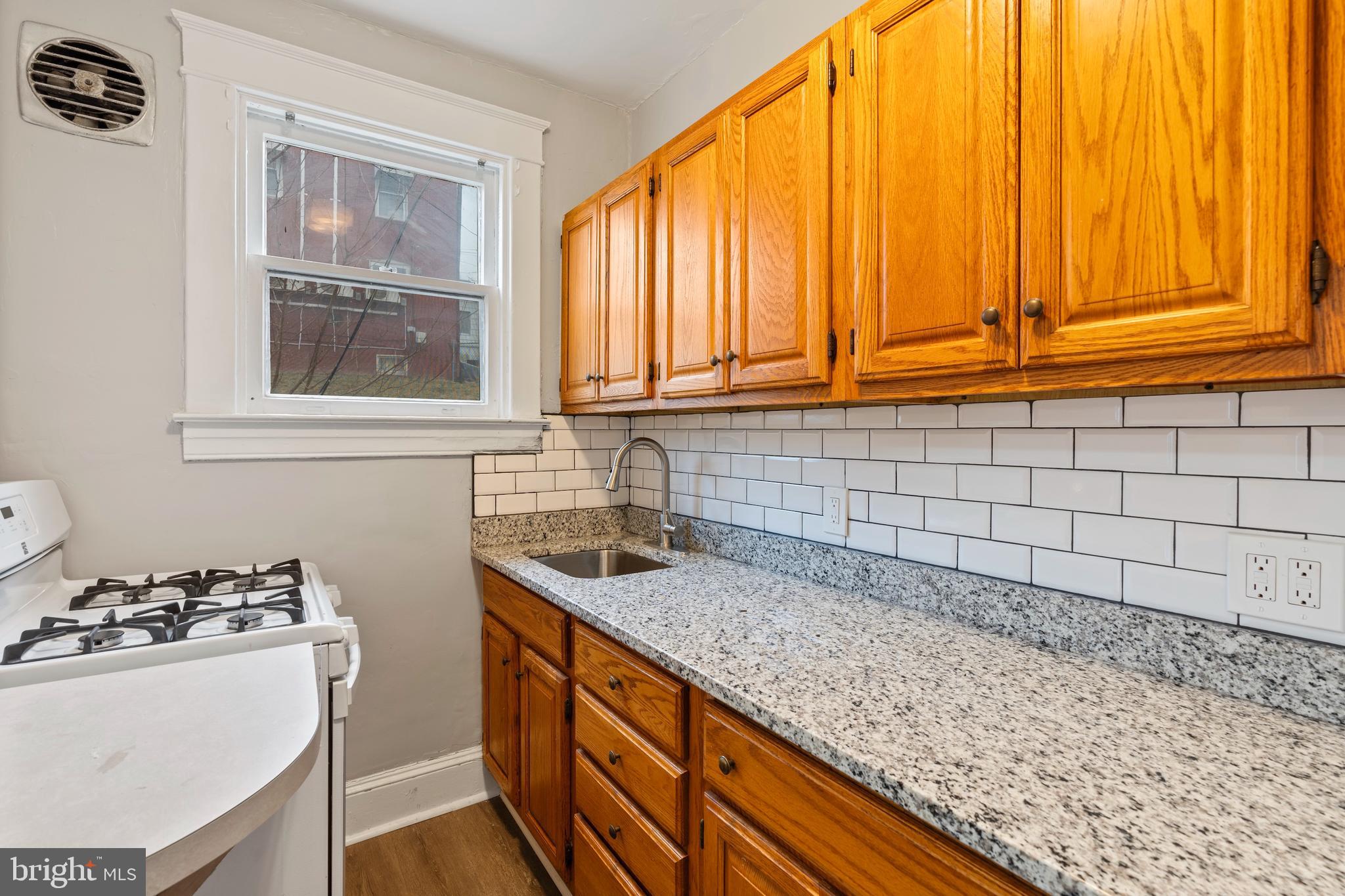 639 Plymouth Road Baltimore, MD 21229 - Photo 8 of 16 a kitchen with a sink and a window