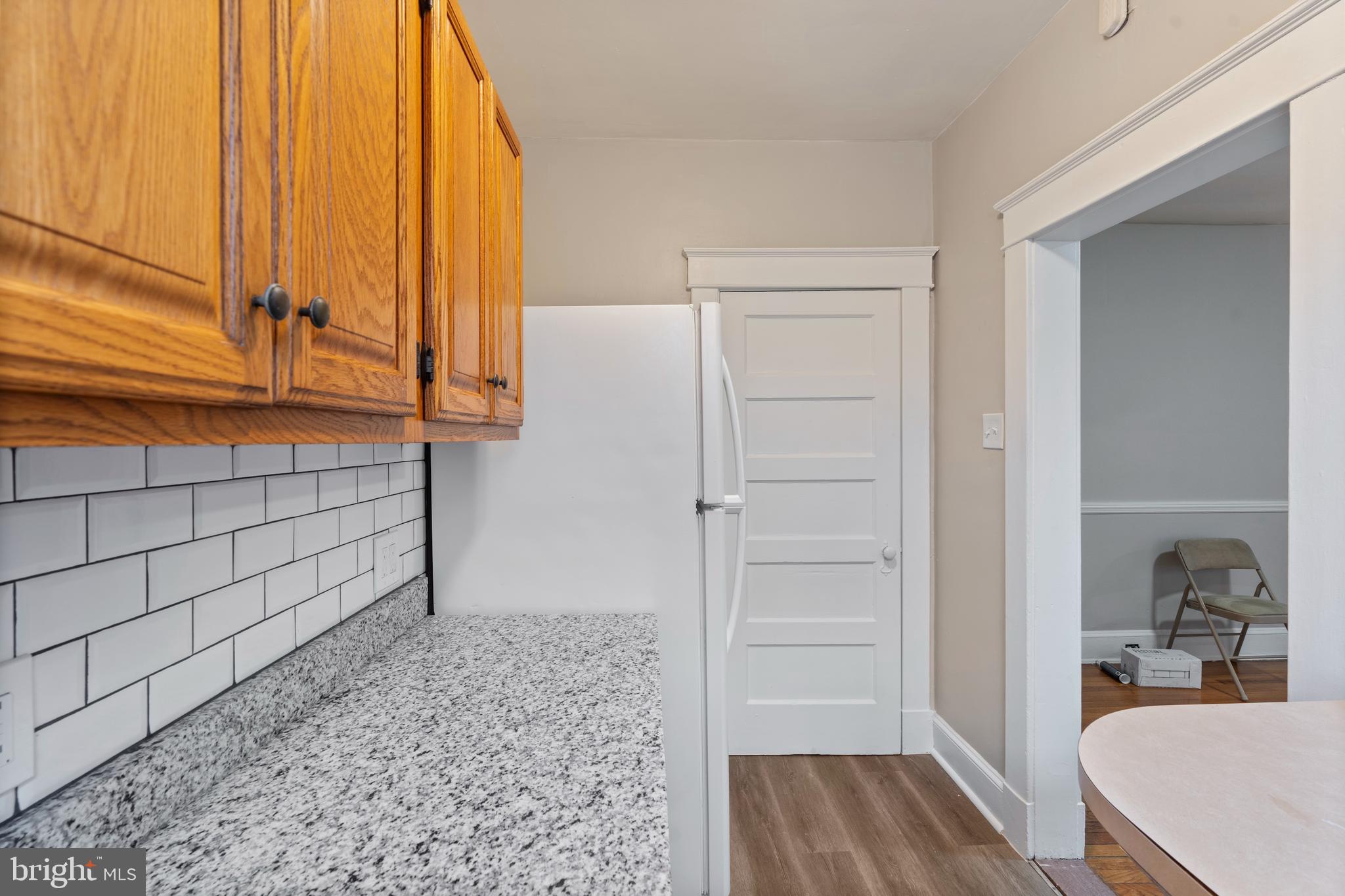 639 Plymouth Road Baltimore, MD 21229 - Photo 9 of 16 a view of a room that has a bed and a window in it
