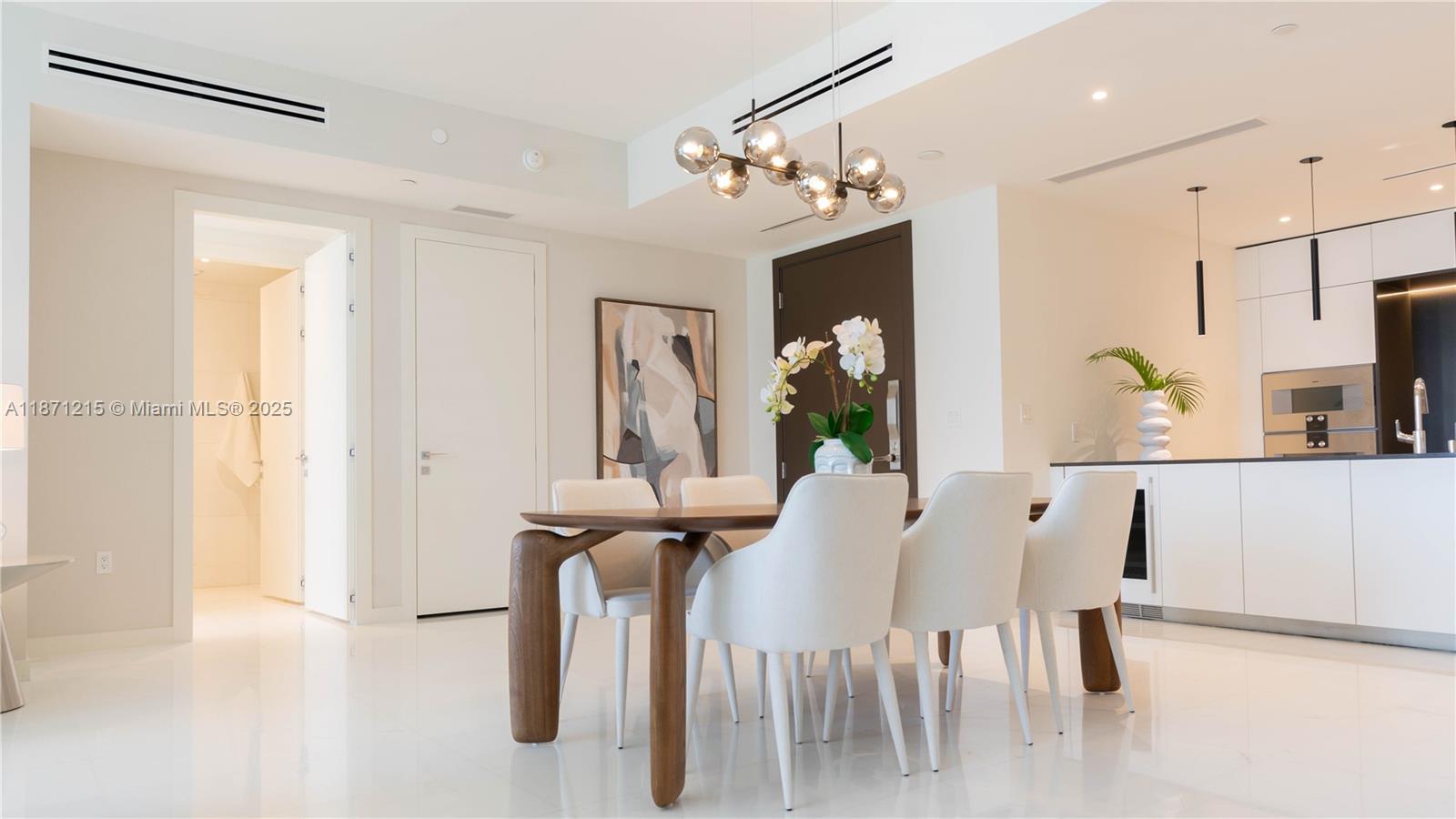 300 Biscayne Blvd Way, Unit 503C Miami, FL 33131 - Photo 14 of 64 a view of a dining room with furniture and a chandelier