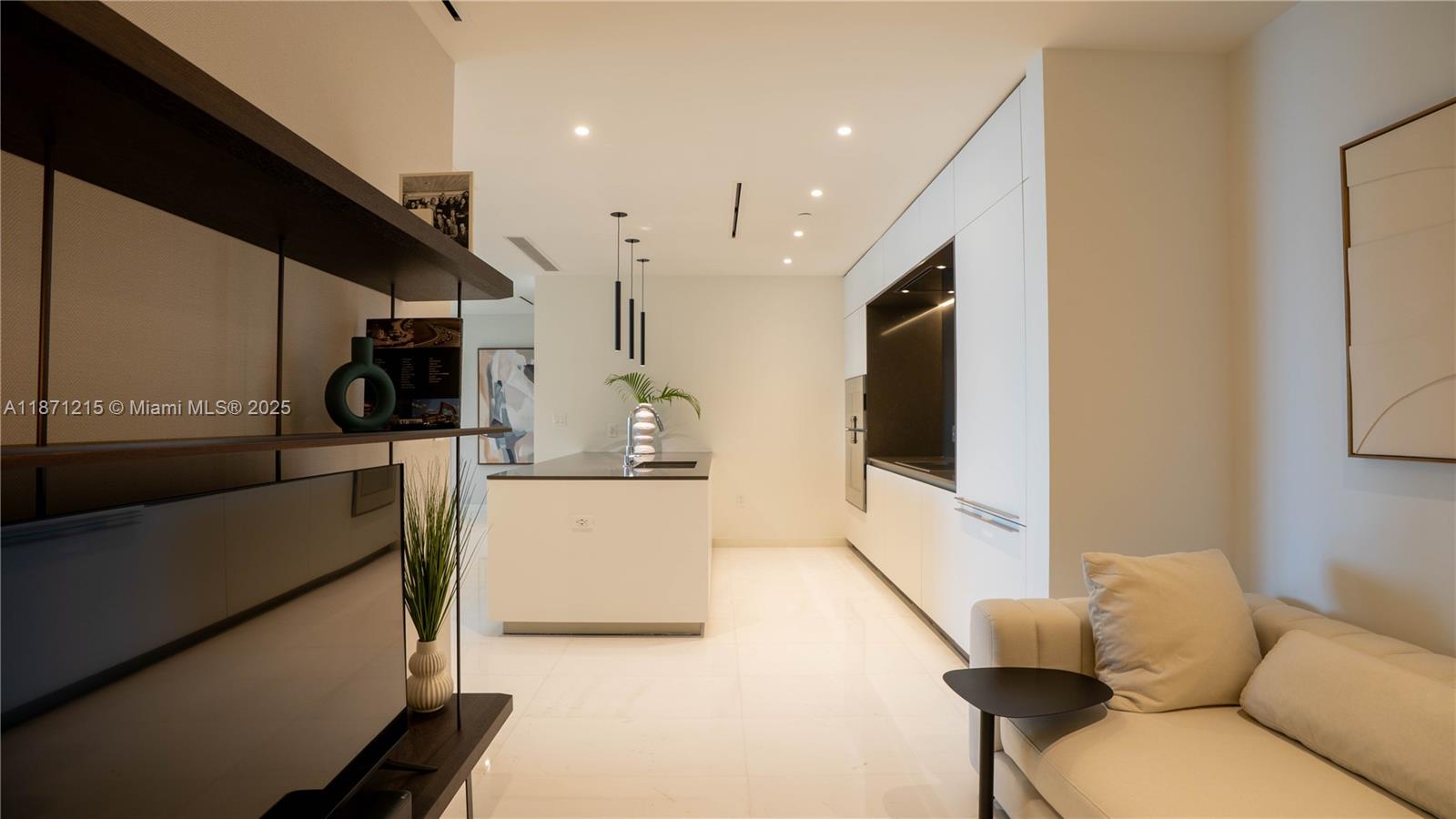 300 Biscayne Blvd Way, Unit 503C Miami, FL 33131 - Photo 16 of 64 a living room with furniture and a flat screen tv